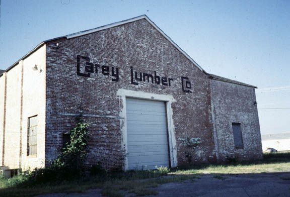A block north of Main Street there was a lumber yard belonging to the same company whose initials we saw on that Main Street cornice a few i