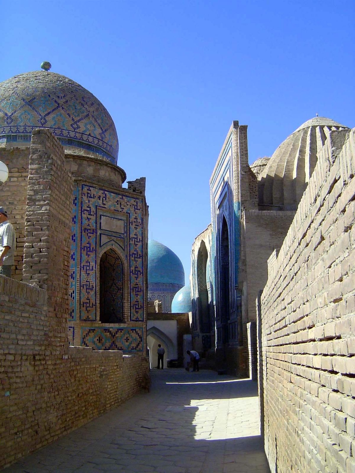 The alley again, with the middle group's mausolea of Shirin Beg Aqa on the left and Shad-e Mulk Aqa on the right.
