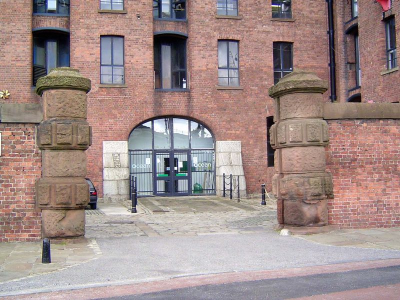 A view of a cart bay showing the massive wall and the slit, on the model of a pocket door, for a sliding gate to deter thieves.