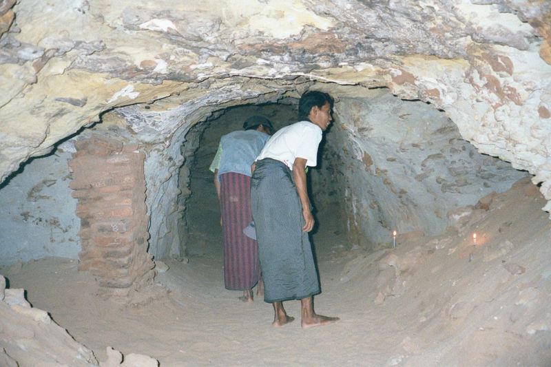 Deeper inside, tunnels lit only by candles and the occasional camera flash penetrate to tiny rooms where monks might meditate at length, und