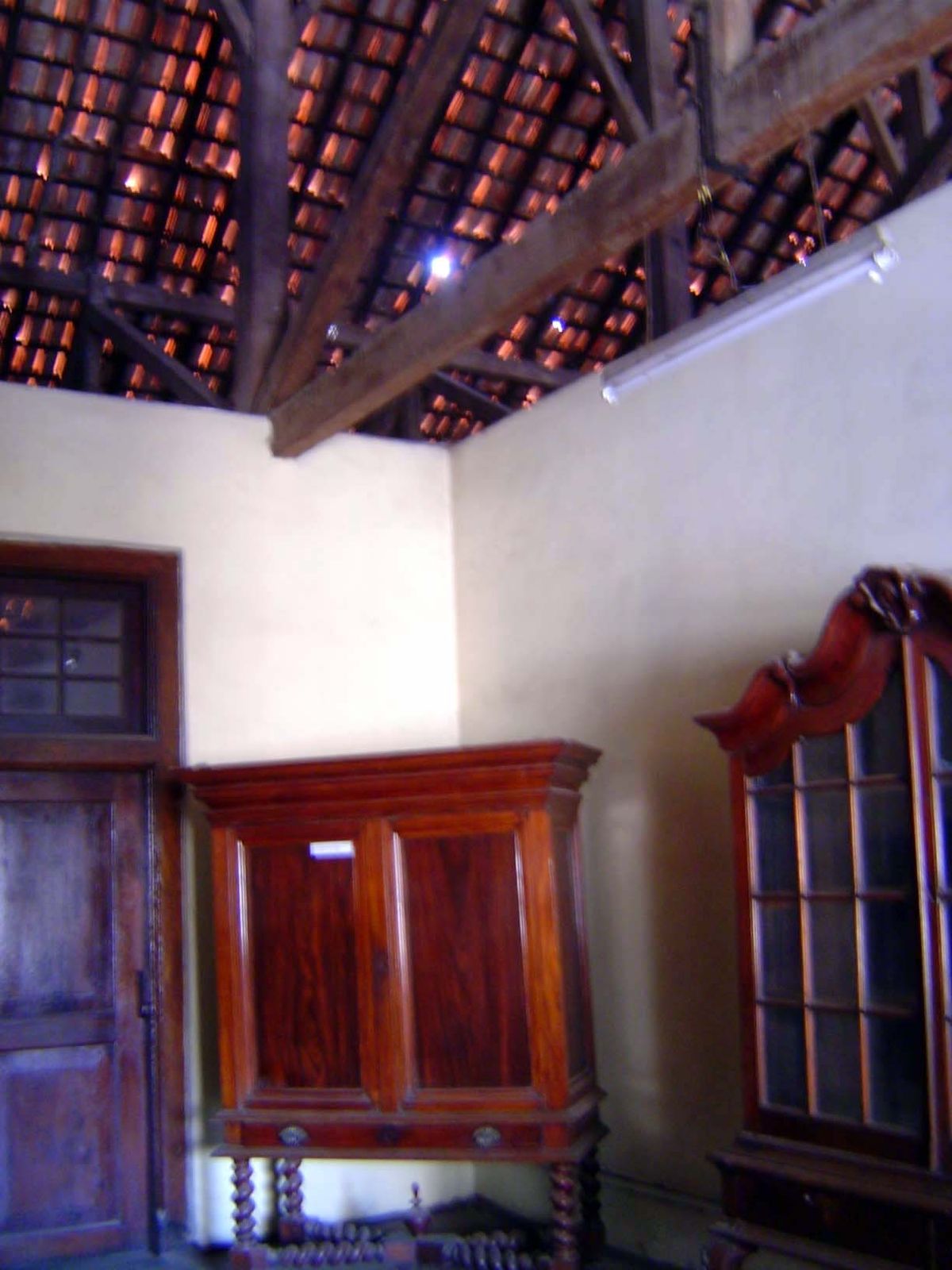 Lots of ventilation: there's no ceiling other than the roof tiles.