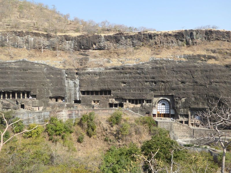 Cave 9 is partly visible behind the branches, while Cave 10 insists on attention. Over at the far left is 16, a key vihara, which set the st