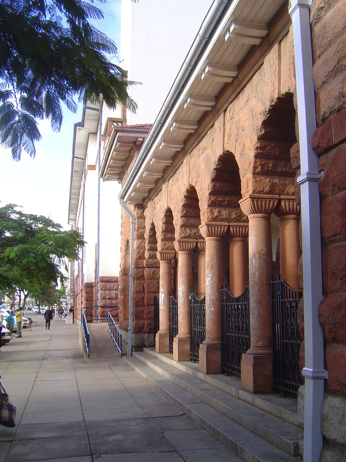 The most interesting part is this older sandstone arcade. The gates are all locked tight. Guess what's behind them.