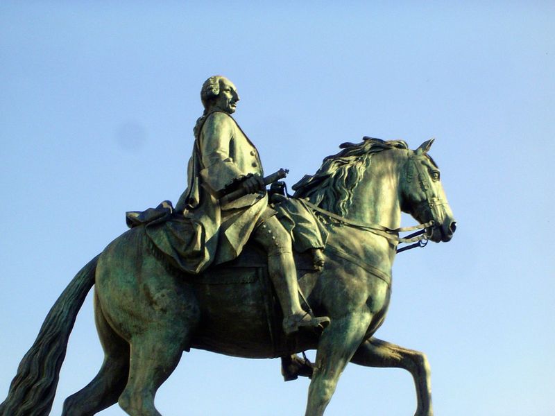 Charles III keeps an eye on the action.