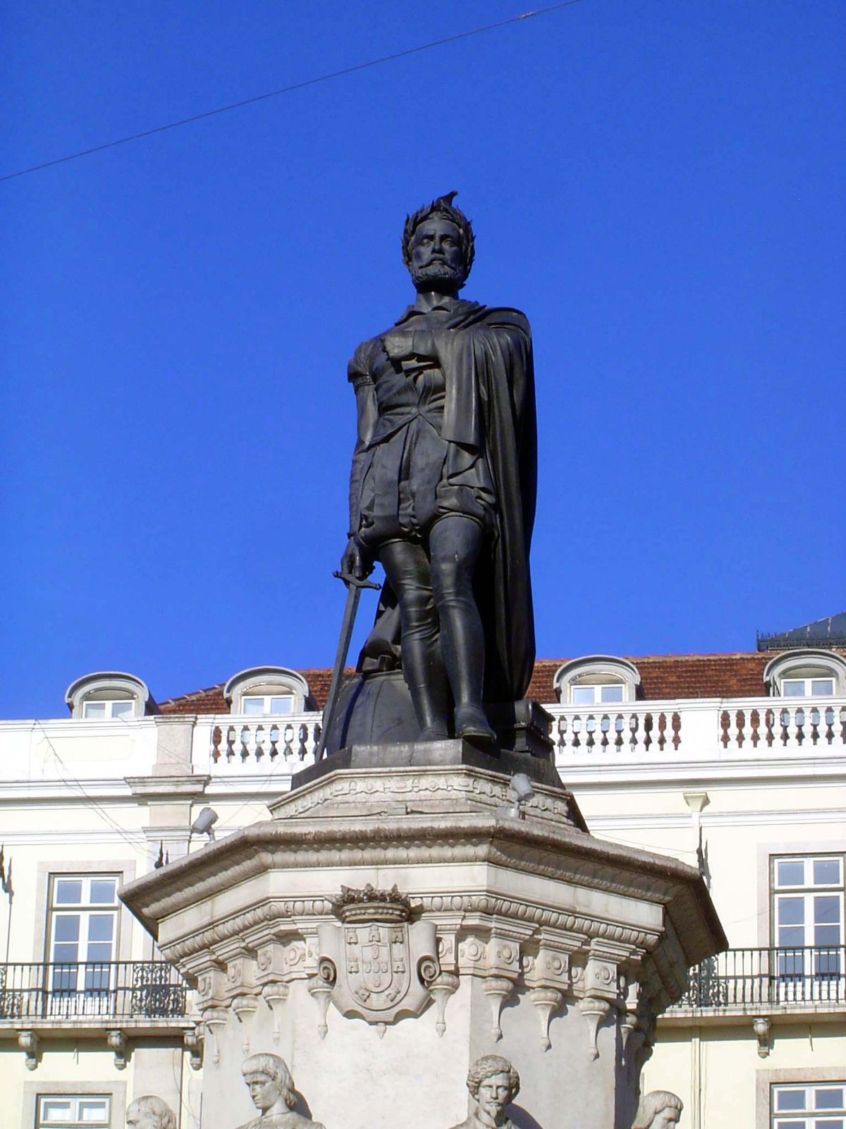 He holds a sword but also, over his heart, the text of his poem.