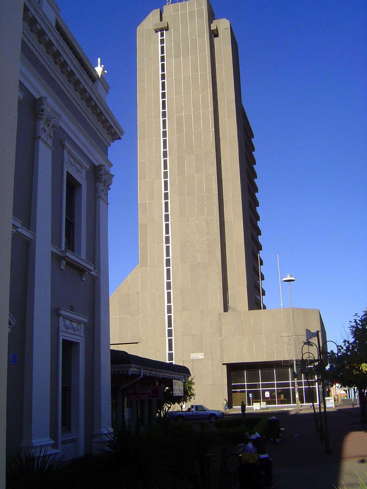 To its right, the hulking provincial office building.