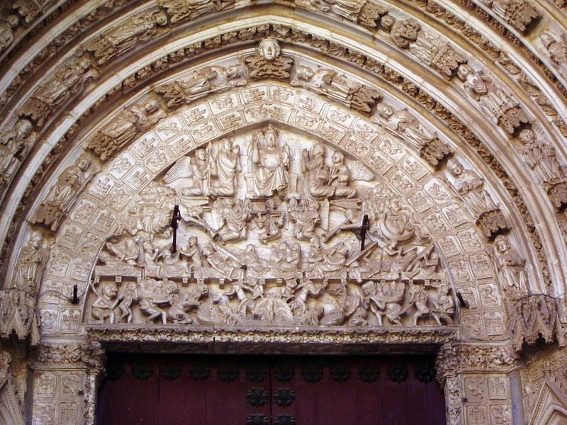 The door on the right is the Puerta del Juicio, or Door of the Day of Judgment.