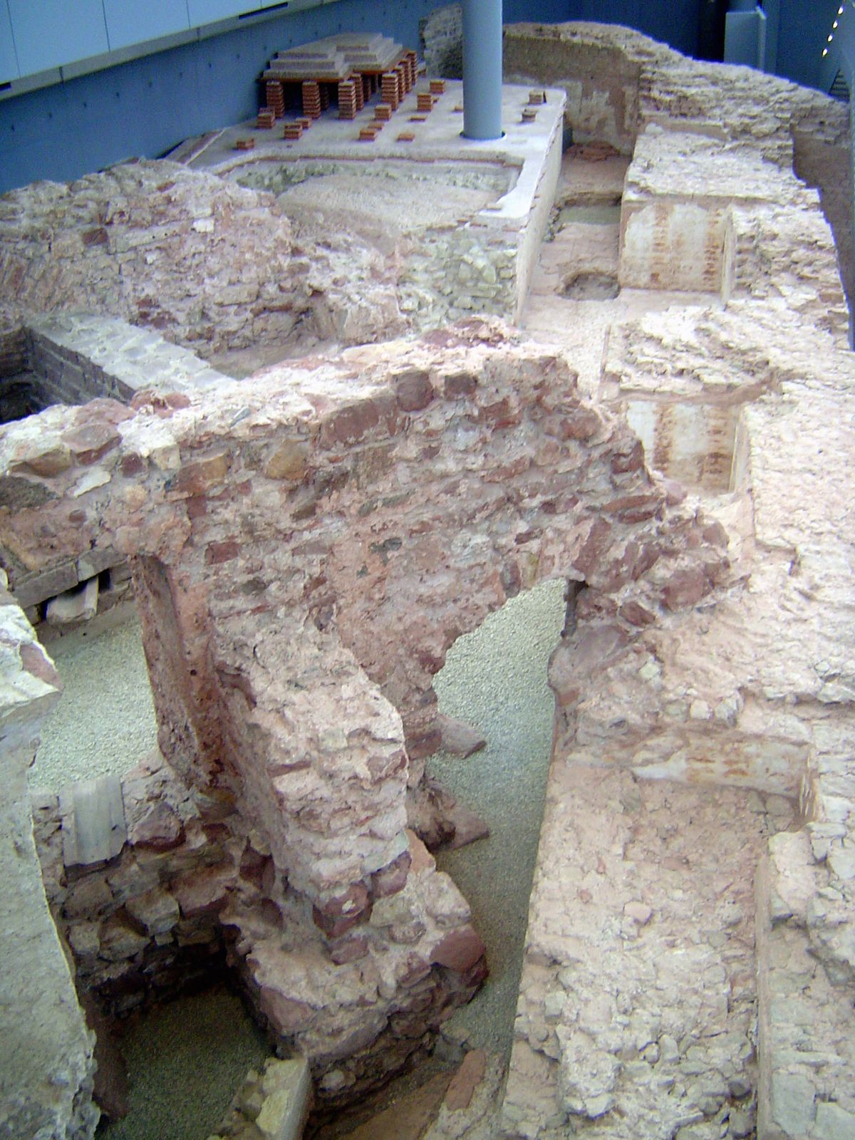 Not far away, archaeologists have dug down and found more Roman relics, now kept under glass. Bricks in aspic.
