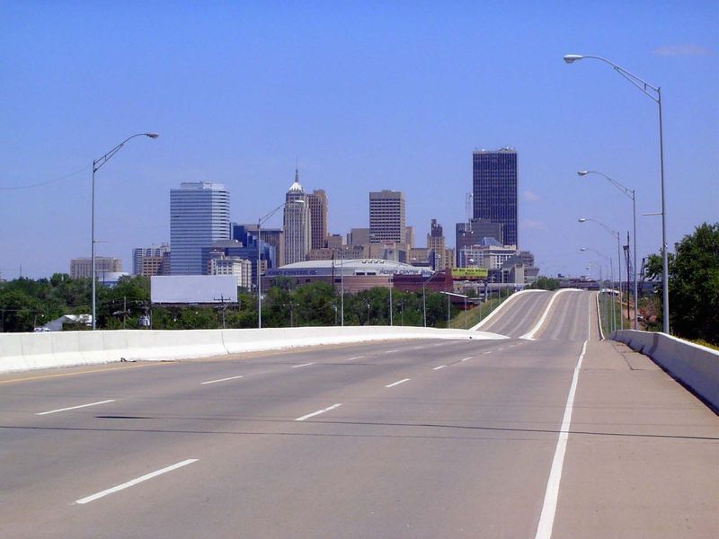 We've stopped one Sunday morning on one of several bridges crossing the river. Downtown is framed by the silvery First Oklahoma Tower on the