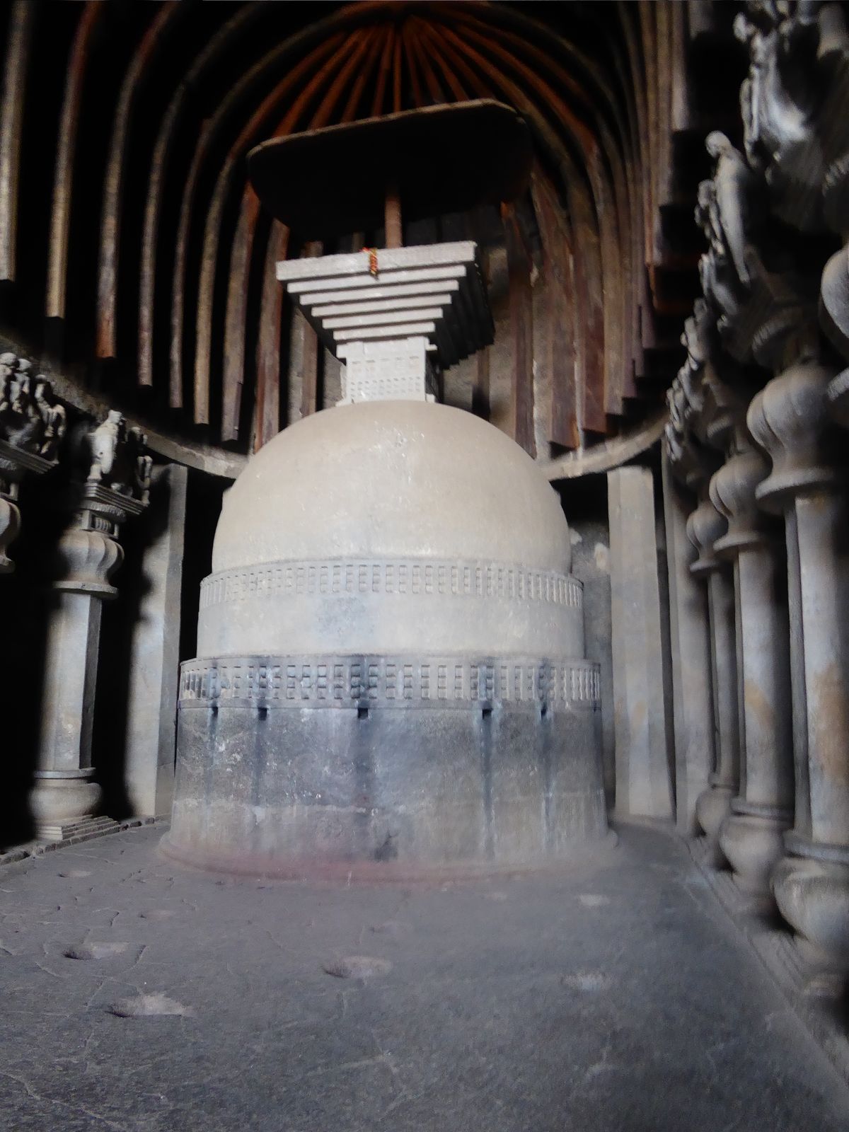 We can cool off inside, where "fifteen pillars on each side separate the nave from the aisles; each pillar has a tall base, an octagonal sha