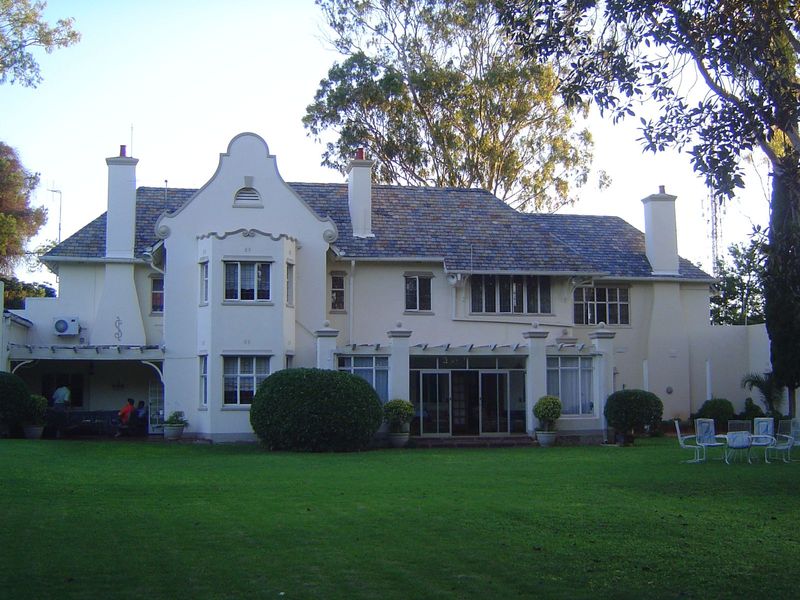 A house in Suburbs. It once belonged to the minister of industry in the Rhodesian government. Back then, it had no perimeter walls, let alon