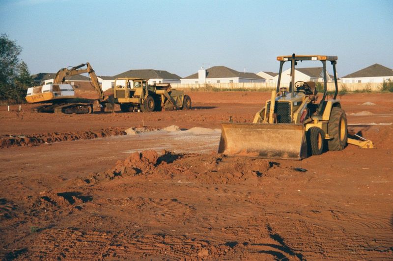 Elsewhere, Norman's doing its best to cover that red dirt with houses. Handsome ones, too, as you can see.