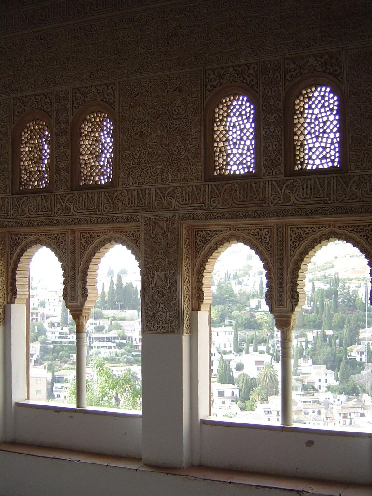 The windows of the oratory look across to Albaicin. The jalis or tracery screens help cut the brightness of the summer sun.