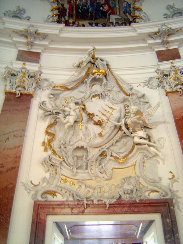 Pevsner says that the cartouche was by a Bavarian stuccoist, Johann Michael Feichtmayr. "Not one part is symmetrical. The main composition i