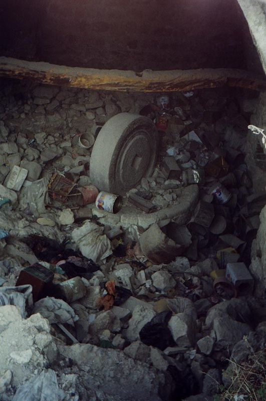Some of the ruins are the results of raids by Israeli security forces. Here, however, an old olive press, once driven around a circular trac