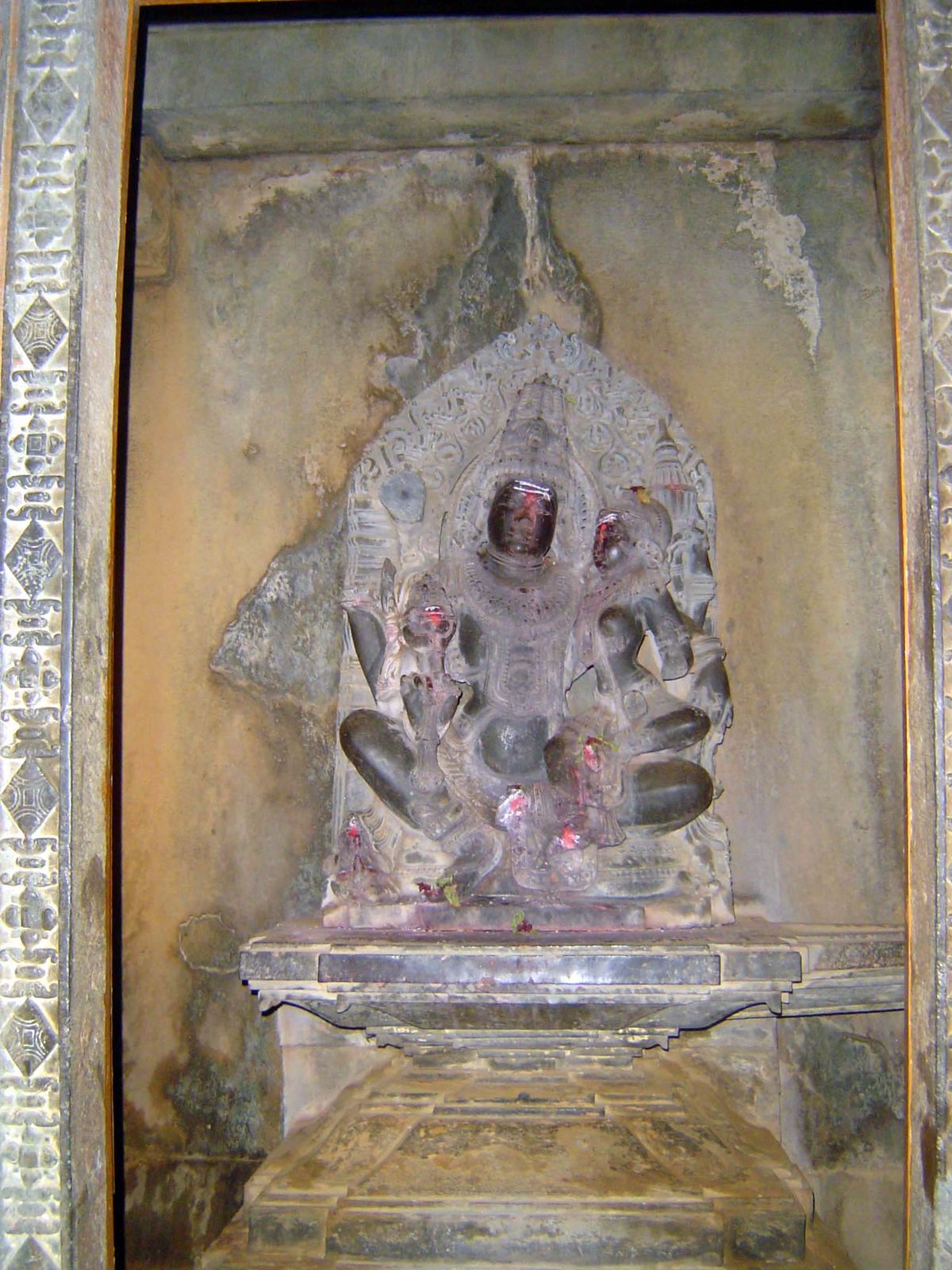 The central cell today contains an image of Lakshmi sometimes called Kamala, or lotus on the lap of Narayan =Vishnu.
