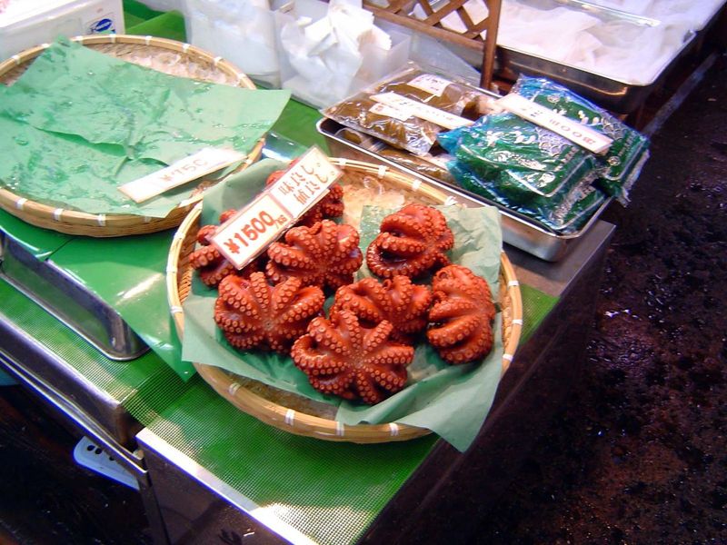Octopi. Beautiful in a way, the market can also seem like a charnal house—a place where the life of the sea is captured, killed, and put on 