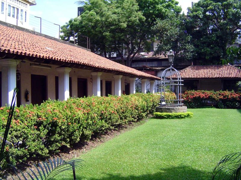 Behind the house there's a rectangular courtyard with a well.