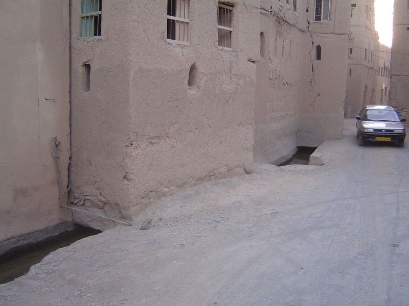 A mechanical intruder. Note the irrigation ditch. It was common for large aflaj to bifurcate, with one channel serving the needs of the palm