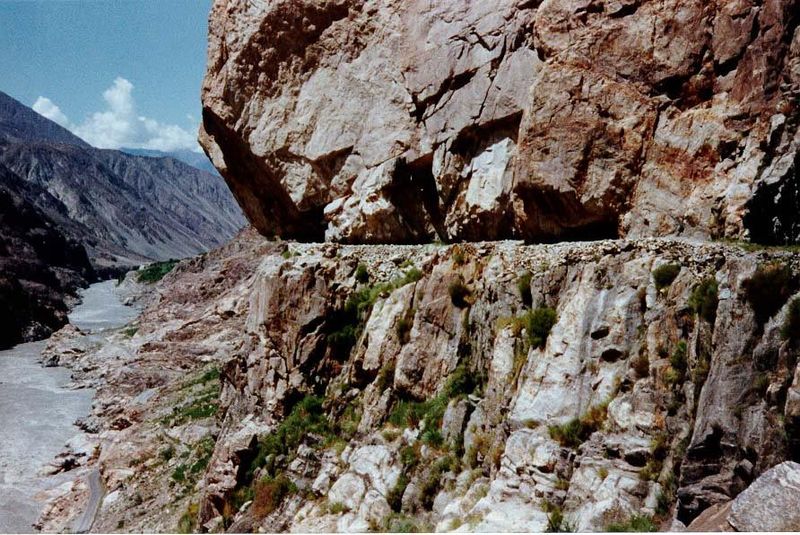 The cliff sometimes overhangs the channel.