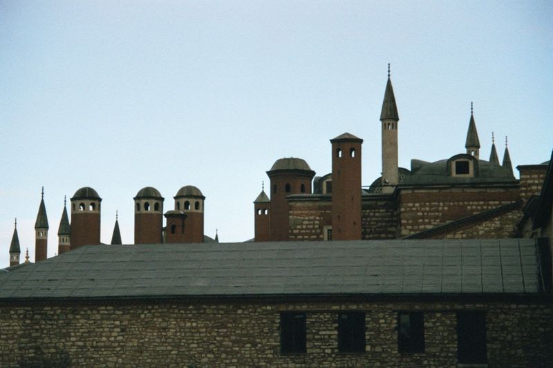 The towers of the harem rise behind the Divan Salonu. The term harem is equivalent to seraglio, an Italian word formerly applied by European