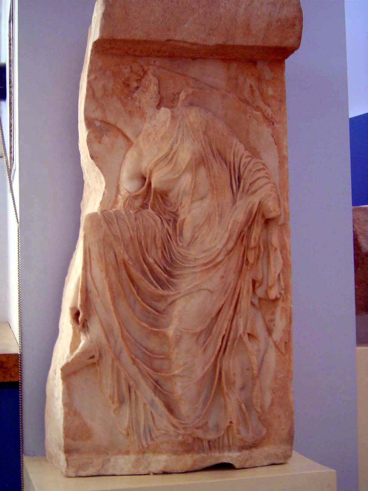 Also in the museum, an image of Nike adjusting a sandle and in her lightness living up to her epithet, "winged."