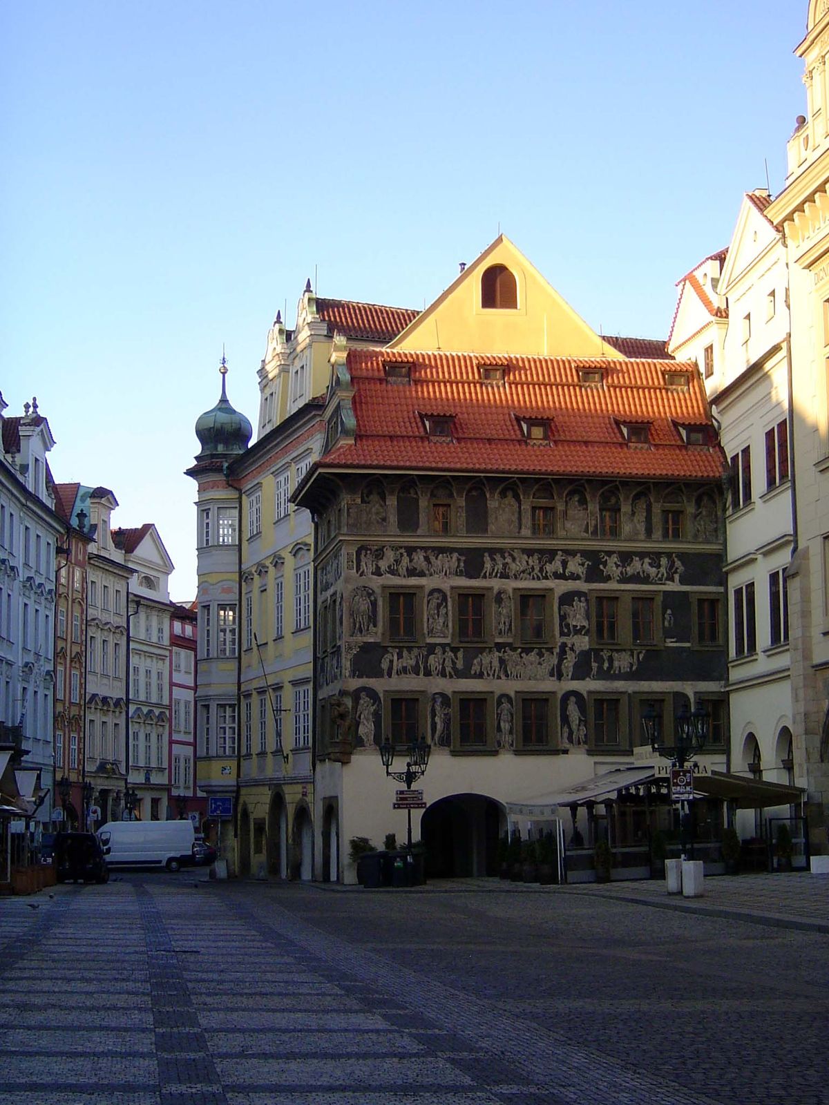 The House of the Minute, Dum U Minuty. The name has nothing to do with time but with the tiny bits of tobacco once sold here. The building i