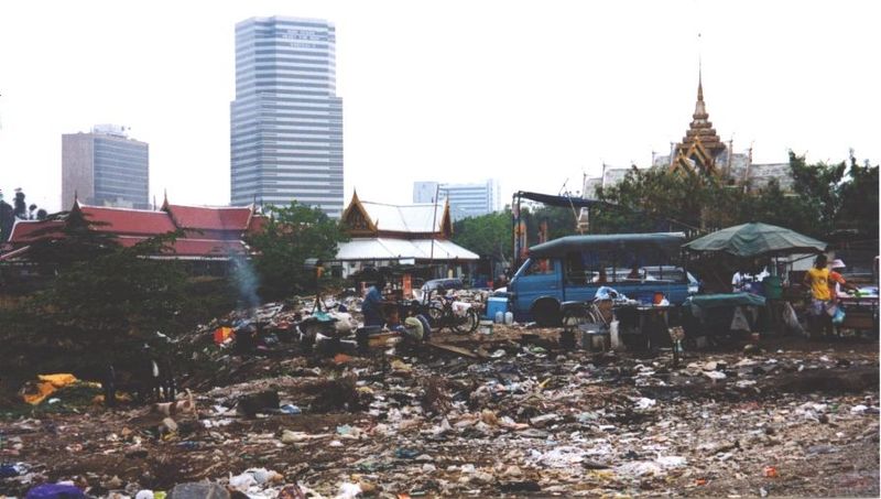 The slum adjoins both a dump and the venerable Wat Padum Vanaram.