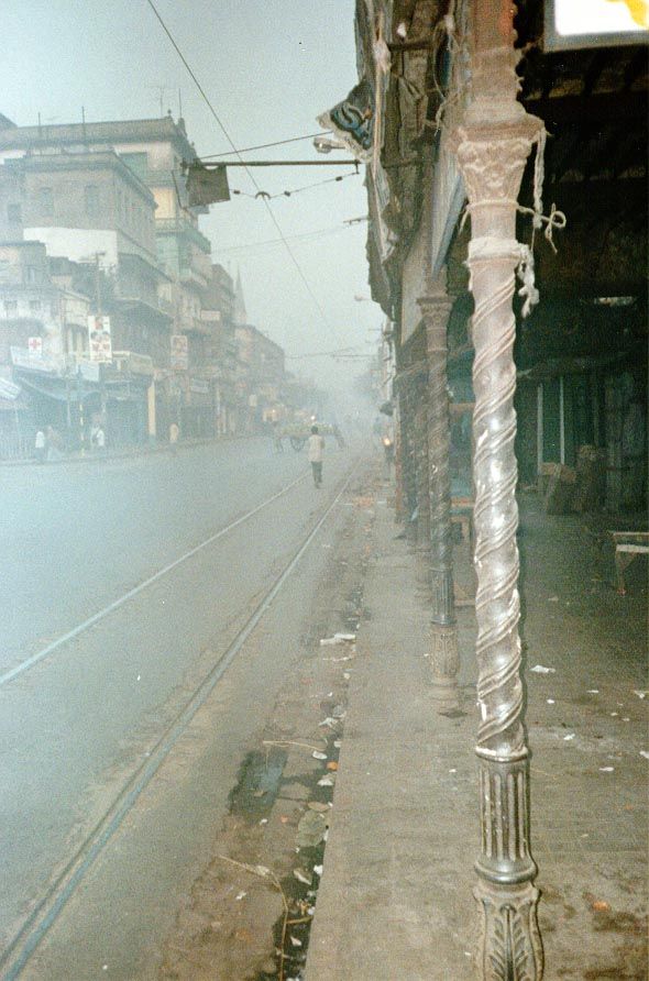 Step out on the street early in the morning. Blink in the gritty haze. The wrought-iron columns are handsome, though.