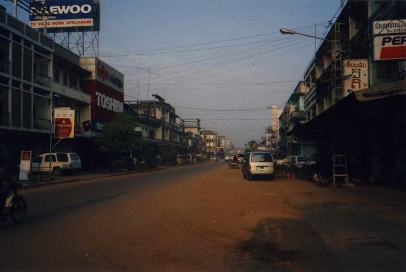Nearby, a commercial street, Samsenthai, gets ready for the morning rush.