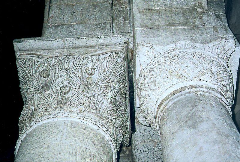The column on the right is older and supports the Byzantine courtyard adjoining the rotunda; the column on the left supports the 12th centur