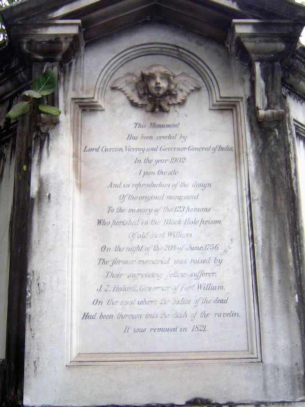 The original inscription, by Curzon, listed the names of the victims and said that they "were, by the tyrannic violence of Siraju'd daulah '
