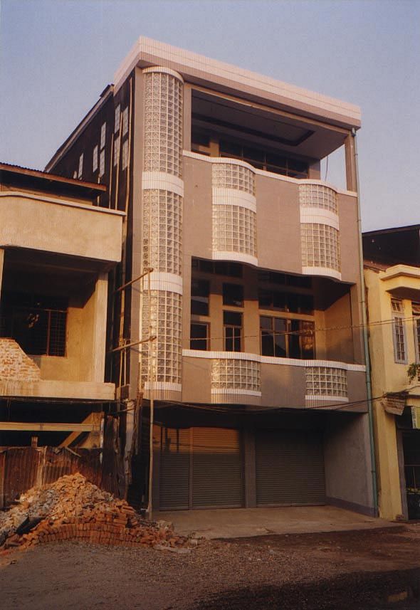 Still, there are also new houses along the road, including this glass-brick one in Kyaikto.