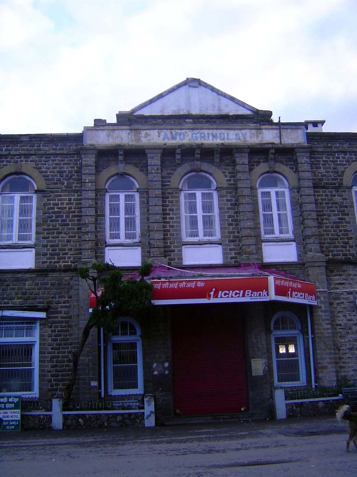 You can make out the name Grindlay; a few years ago, the sign below read Barclay's.