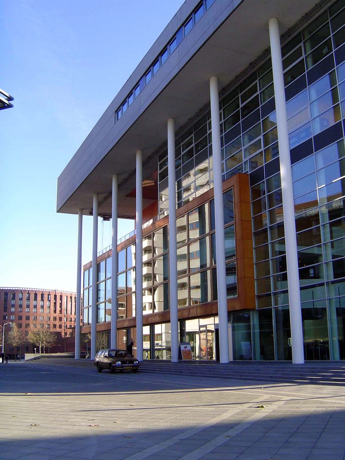 Behind the apartment building is the Centre Ceramique, a municipal hall, library, and archive designed by Jo Coenen, who masterplanned the w