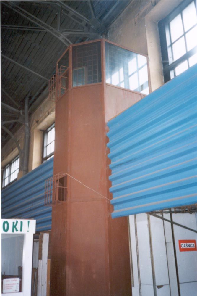 Inside: a security tower, a reminder that not everyone could be relied upon to take only according to their needs.