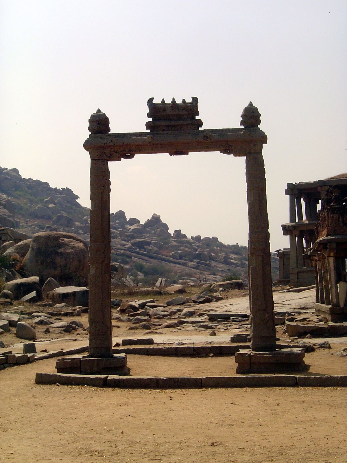 We're going to walk back toward Virapaksha. First up, the so-called King's Balance, properly the Tulapurusha-dana Monument.