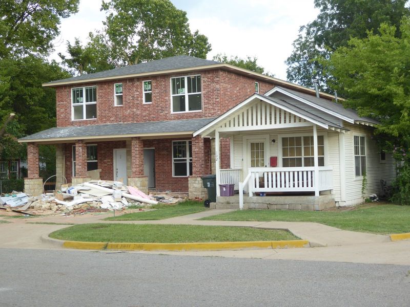 The residential neighborhood around campus corner and extending toward Main Street began seeing investments in duplexes and small apartments