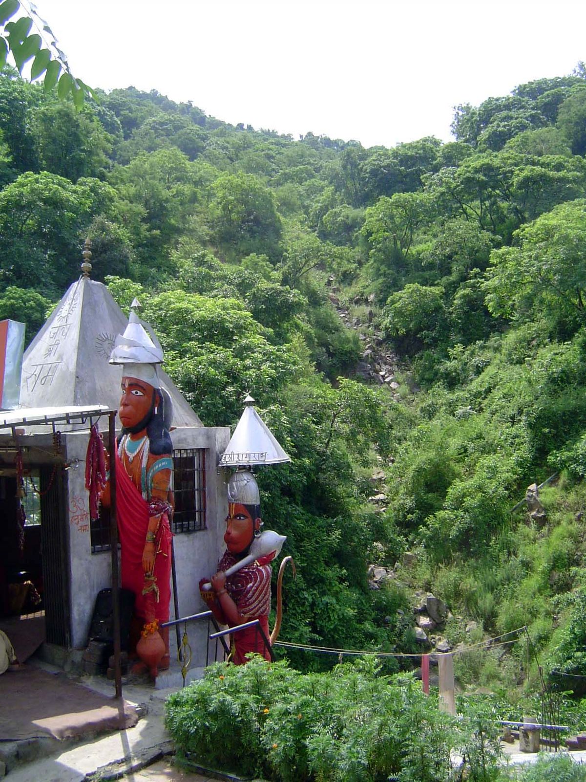A temple and old road below at the foot of the mountains.