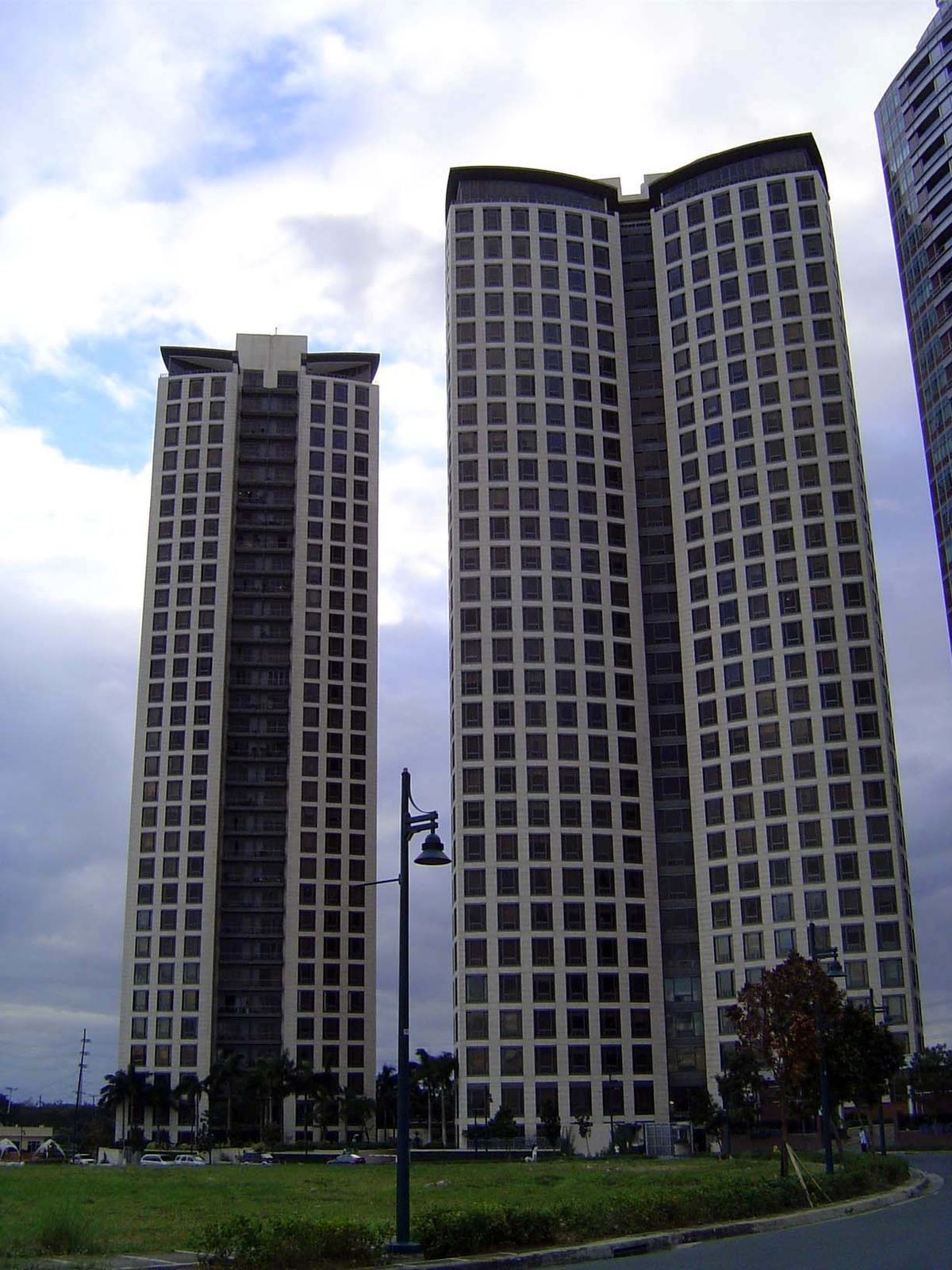 Here's nearby Essensa, one of the "premier high-rise residential condominiums in Metro Manila. The graceful concave buildings resembling but