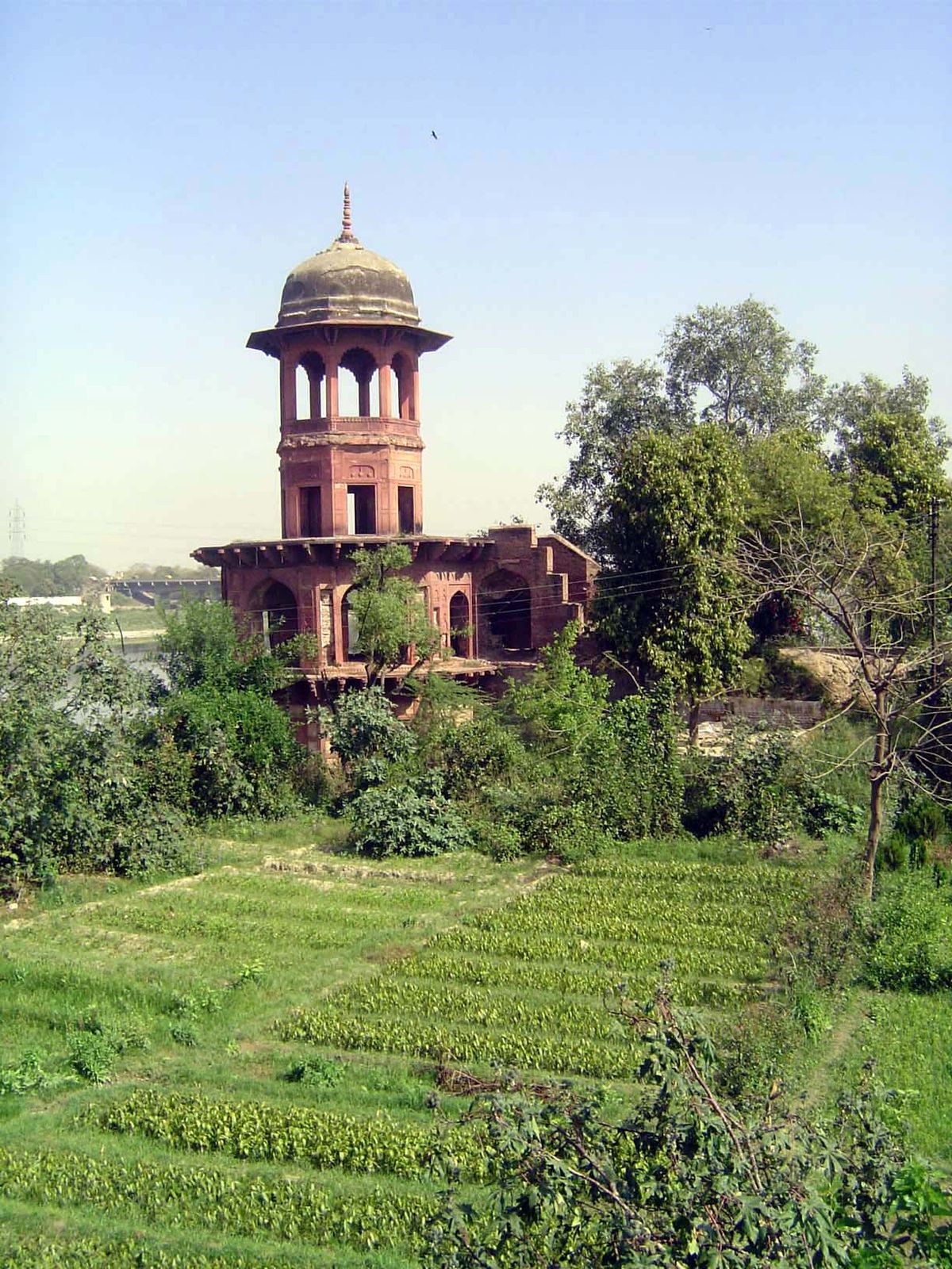 The view upstream along the Yumuna. The structure is part of the pump that once lifted water to the surrounding garden.