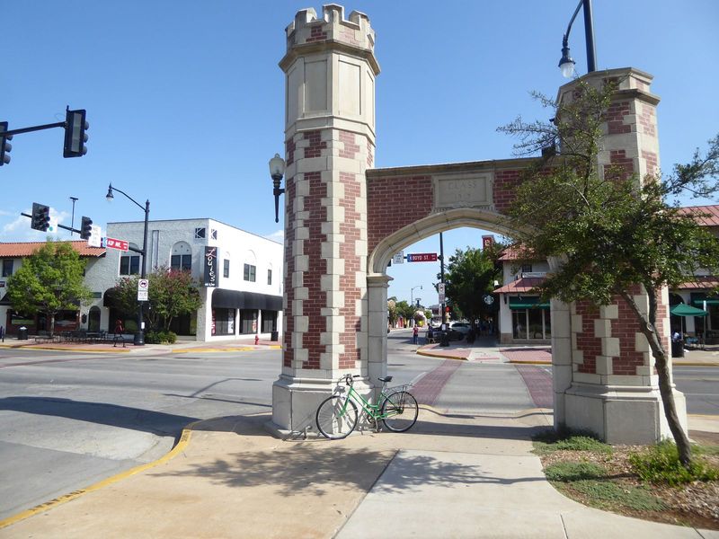Back up on Campus Corner, we have the iconic gateways given by the class of 1919. And who's across the street? But who else?