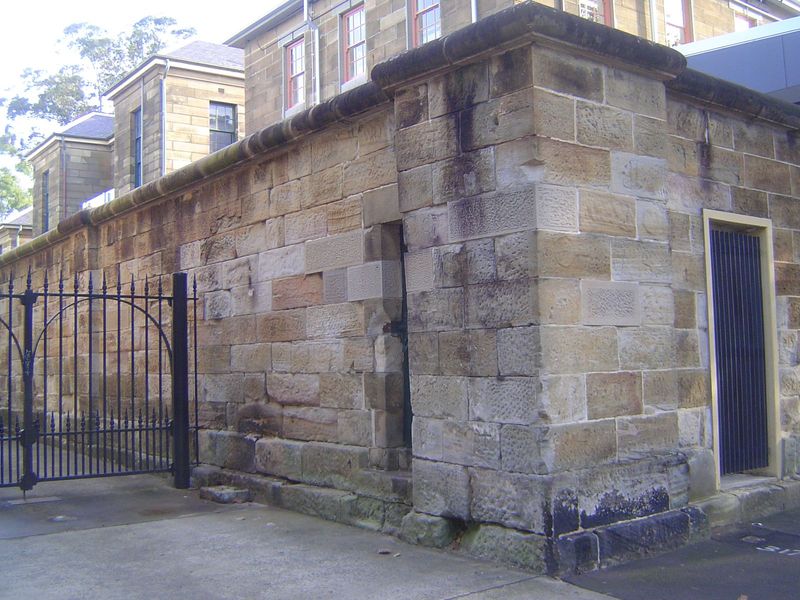 Out back, there's a fine wall of Hawkesbury sandstone. What's behind it? The answer is the fine, Panopticon-style Darlinghurst Gaol, designe