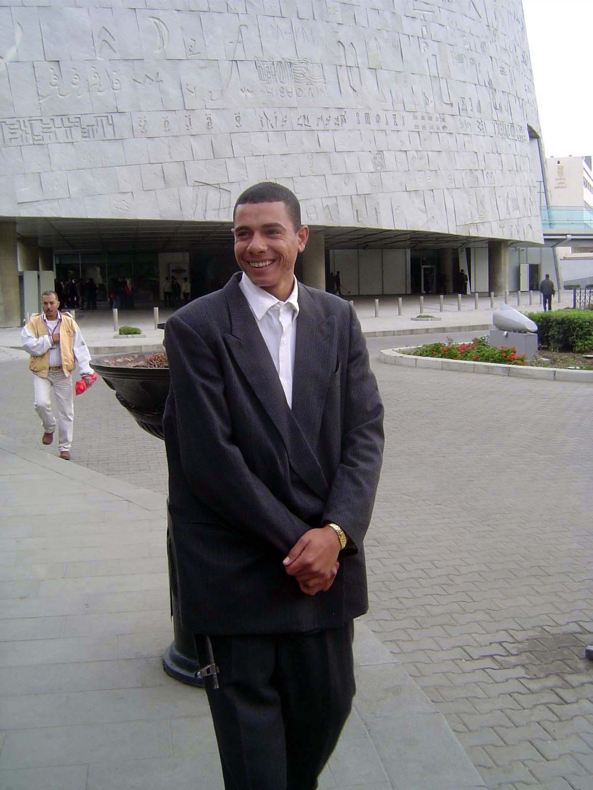 A plainclothes security guard, with a none-too-subtle weapon.