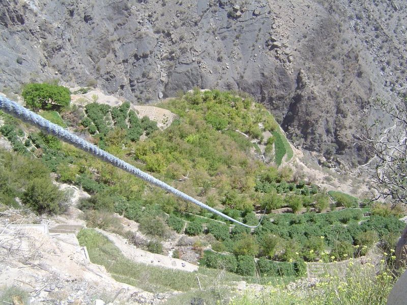 Here, the rope down to Al Ayn's lower terraces.