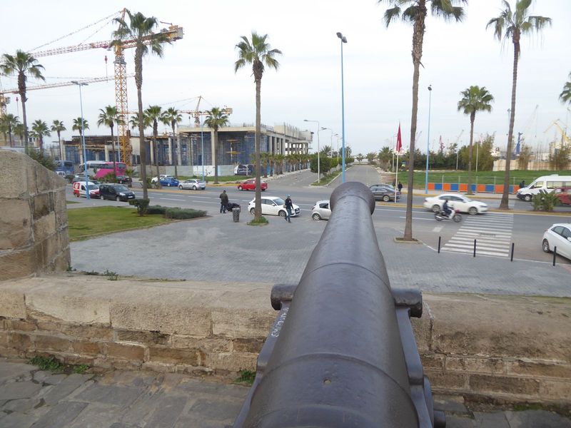 The cannon point ineffectually at the artificial harbor begun by the French.