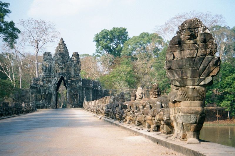 The south gate, with a naga bridge over the city moat. The serpent's heads flare on the right, while lined-up demons or asuras pull on its b
