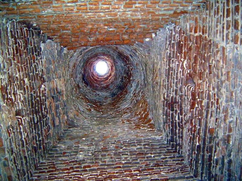 The interior is corbelled, with a transition from rectangle to cylinder.