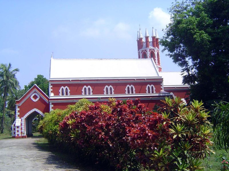 On the other side of the peninsula, and facing the left branch of the Mahanadi, the old Church of St. Michael and All the Angels is locked t