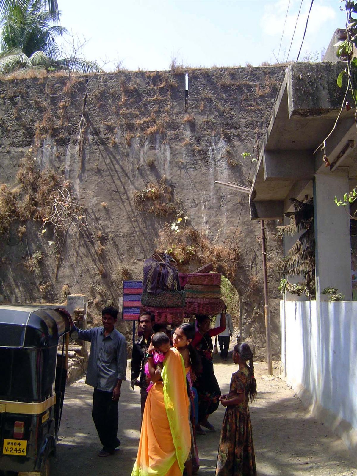 Head loads to and from the fort, through the postern.